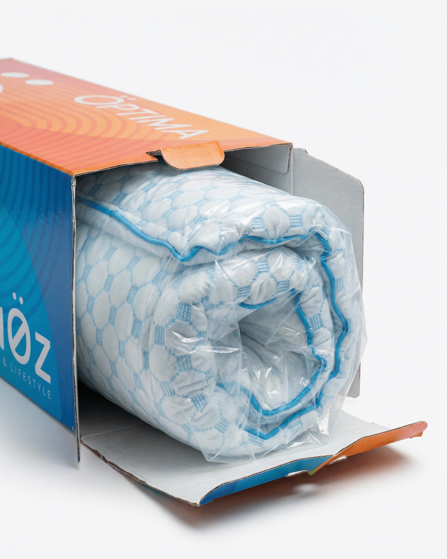 oreiller enroulé dans la boite